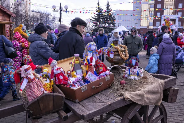 Vladimir, Russia - March 1, 2020: Shrovetide celebration. Traditional textile dolls in Russian folk costumes to participate in the city competition