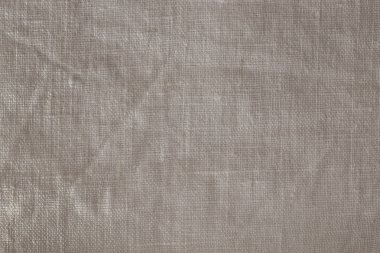 Pürüzlü gri keten arkaplan dokusu ön görünümü kapat.