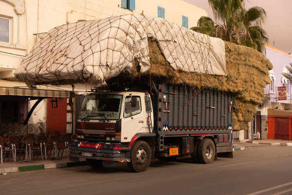 A truck loaded with hay