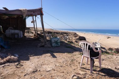 chair and a fishing hut at the beach in southern Morocco