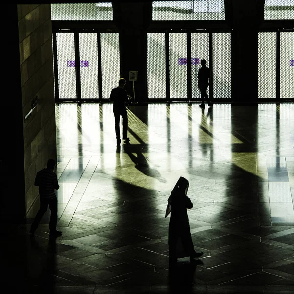 People silhouttes at Museum of Islamic Arts (MIA) In Doha, the capital of Qatar in the Gulf Area. Stock Image