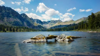 Lake among the mountains and taiga