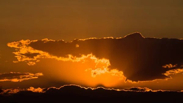 Cloudy sky at sunset orange