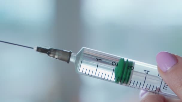 Close-up shot of syringe during injection, drug addiction problem, aids epidemic, vaccination. Medicine liquid delivering to patient body — Stock Video