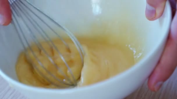 Man hands whipping raw eggs — Stock Video
