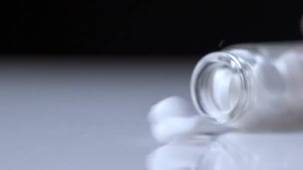 Hand Pours Out Bottle Of Pills On To Table In Slow Motion — Stock Video