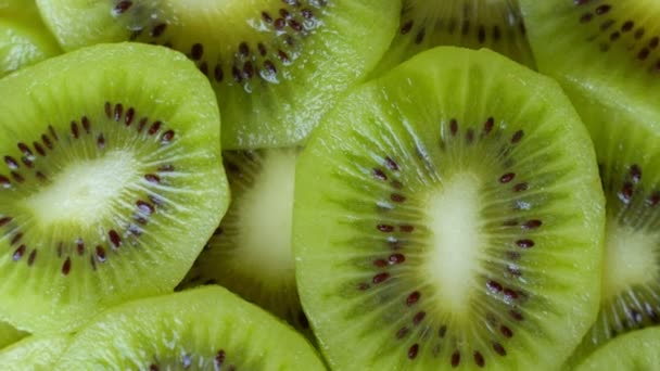 Macro rotação filmagem de vídeo de kiwi de fatia fruta.Close-up carne de kiwi . — Vídeo de Stock