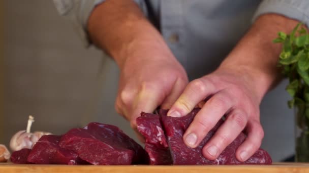 Hand cuts raw meat with the knife. Slow Motion — Stock Video