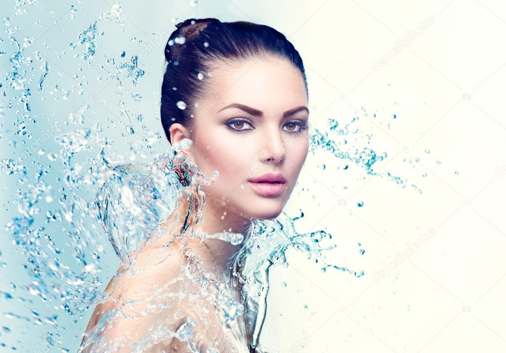 woman under splash of water 