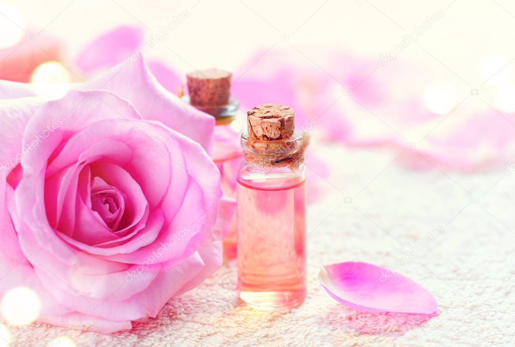 Bottles of essential rose oil for aromatherapy