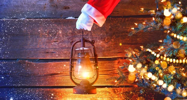 Santa Hand Holding Vintage Oil Lamp Wooden Background Blurred Christmas — Stock Photo, Image