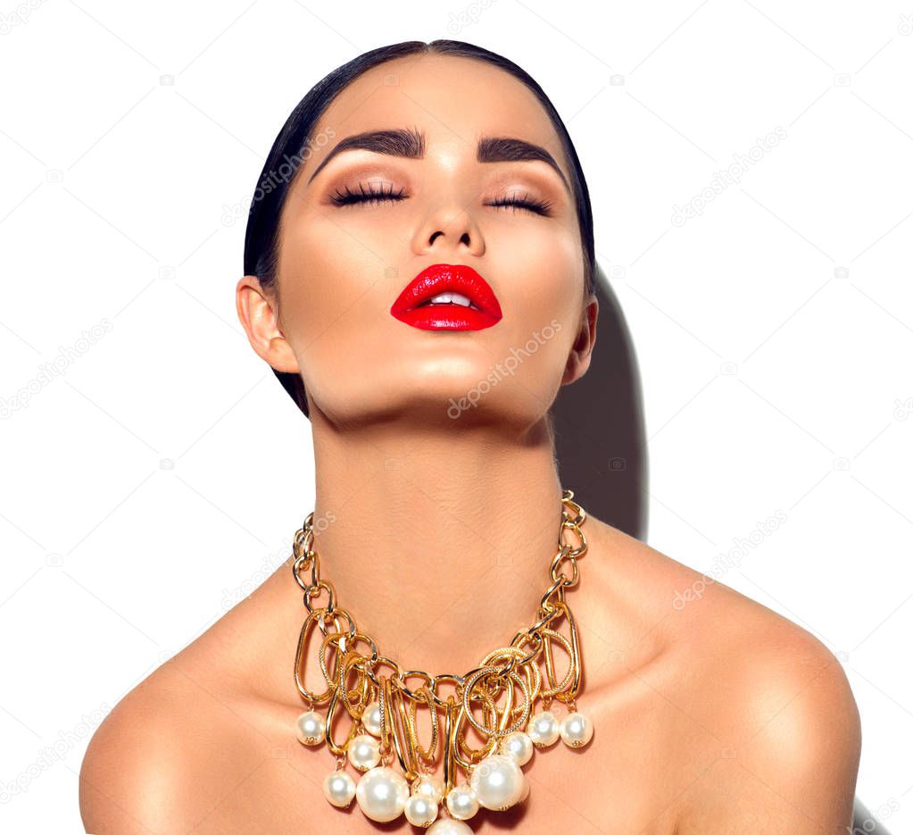 fashion model with red lips and trendy golden accessories