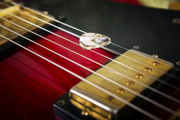 Red acoustic guitar — Stock Photo, Image