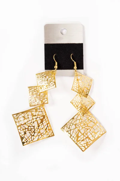 Women's gold earrings — Stock Photo, Image