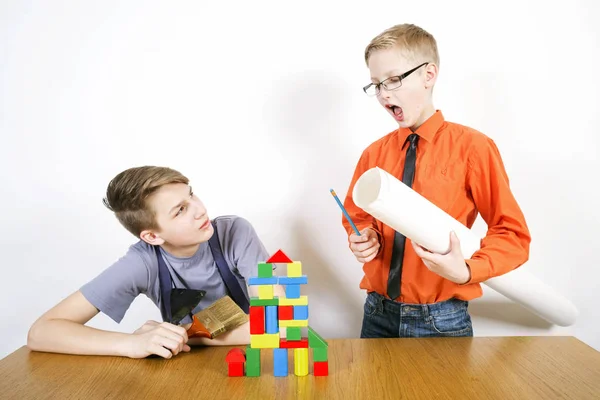 Boys play in construction of the house. Construction concept. — Stock Photo, Image