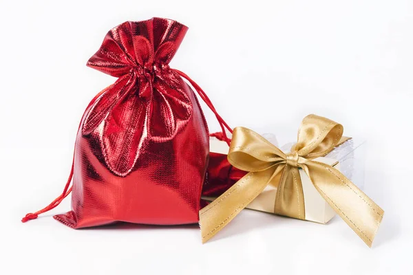 Red bag  and  gold bow — Stock Photo, Image