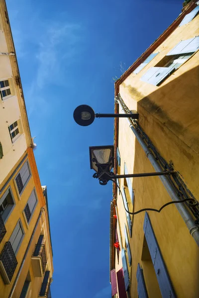 Facades of old yellow houses — Stock Photo, Image