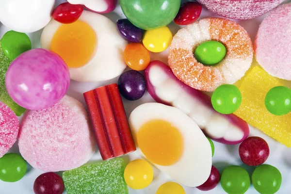 Színes cukorkák és zselé háttér — Stock Fotó