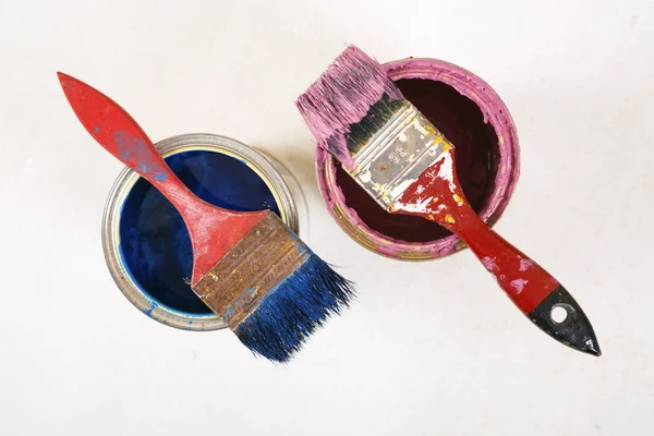 Full of blue paint tines and paint brushes on it — Stock Photo, Image