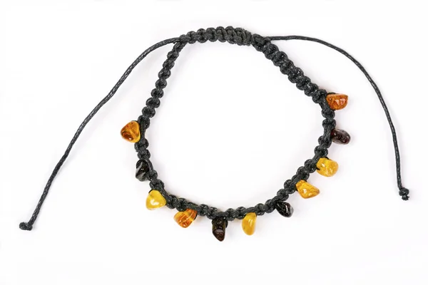 Bracelet made of amber beads and black cord — Stock Photo, Image