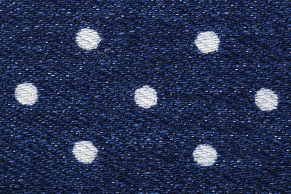 Impressão de selo de ervilhas no tecido de jeans azul jeans — Fotografia de Stock
