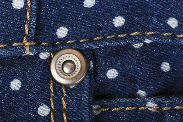 Erwten stempel afdruk op denim blue jeans stof — Stockfoto