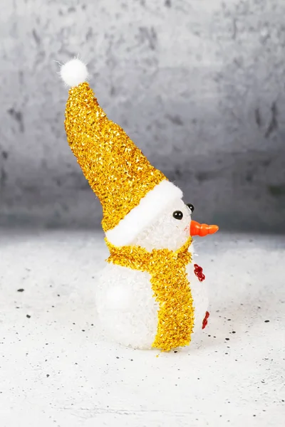Snowman wearing hat and scarf — Stock Photo, Image