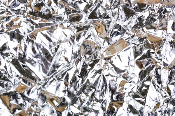 Silver crumpled foil background — Stock Photo, Image