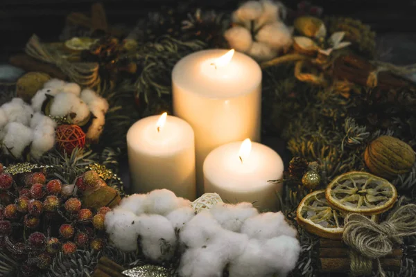 White burning candles in a christmas wreath — Stock Photo, Image