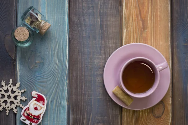 Christmas still life with tea cup, tiny jars, christmas-tree toys — Stock Photo, Image