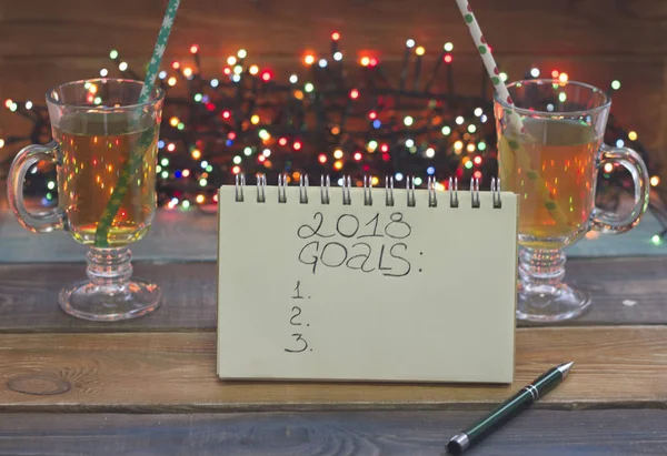 A festive still life with tea and 2018 goals inscription — Stock Photo, Image