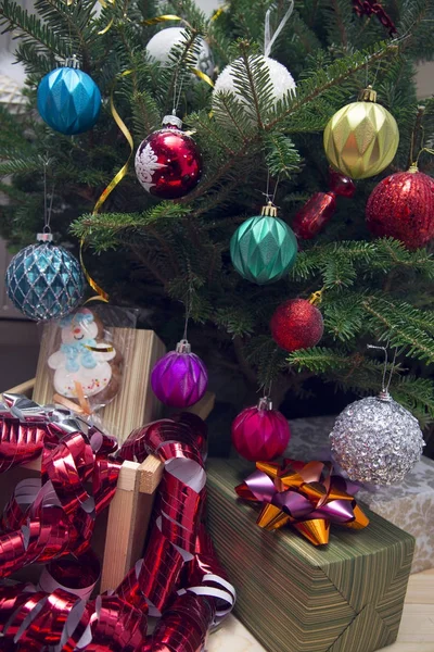 Gifts under a decorated Christmas-tree — Stock Photo, Image