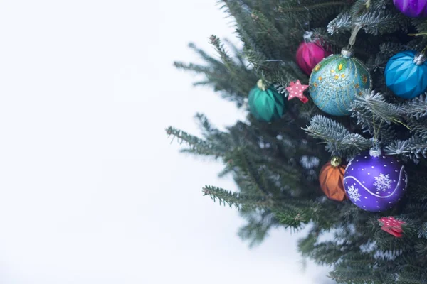 A decorated Christmas tree outside with colorful baubles made of glass — Stock Photo, Image