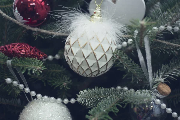 A vintage white ball on a fir tree branches — Stock Photo, Image