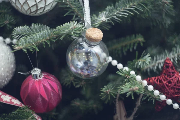 A glass ball on a fir tree branches — Stock Photo, Image