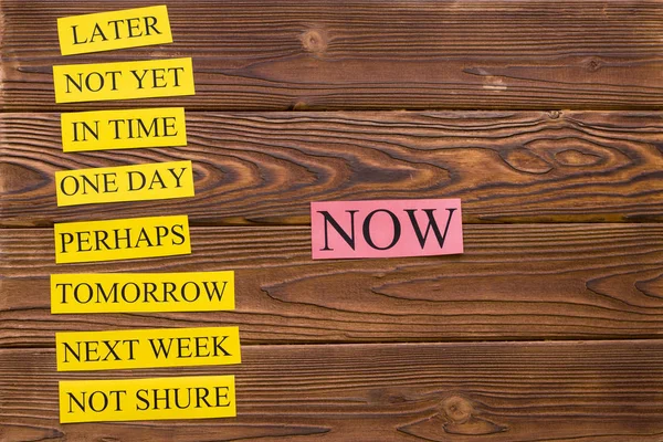 Motivation words on a rustic wooden table