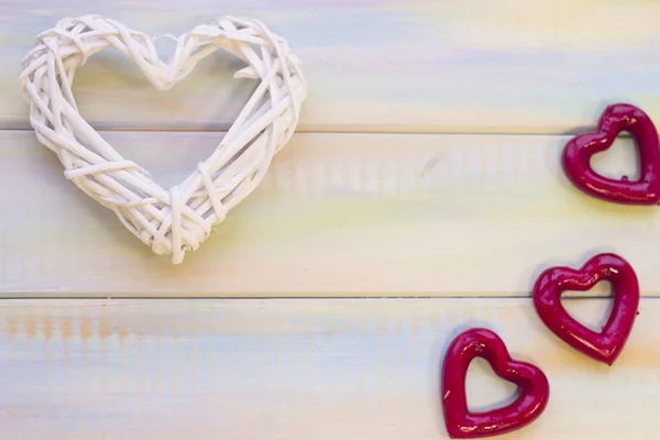 St. Valentines wooden background with woven heart