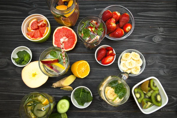 Detox water on black stone background — Stock Photo, Image