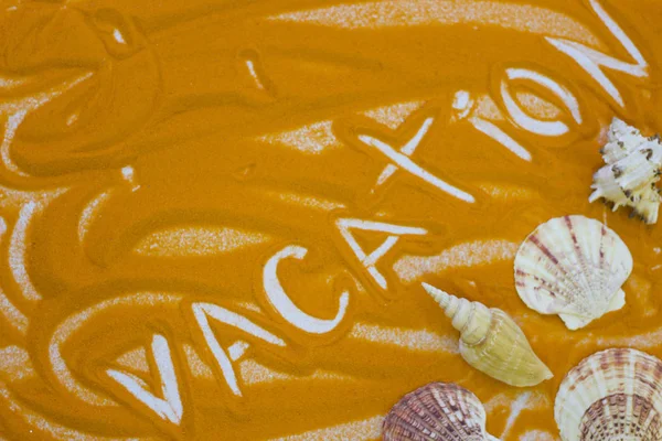 Inscription on a colorful sand — Stock Photo, Image