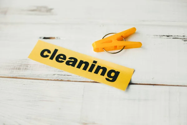 Cleaning inscription and a clothes brush — Stock Photo, Image
