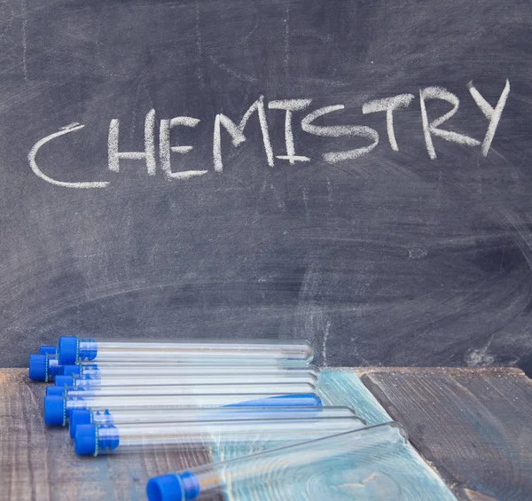 Books on a black chalkboard — Stock Photo, Image