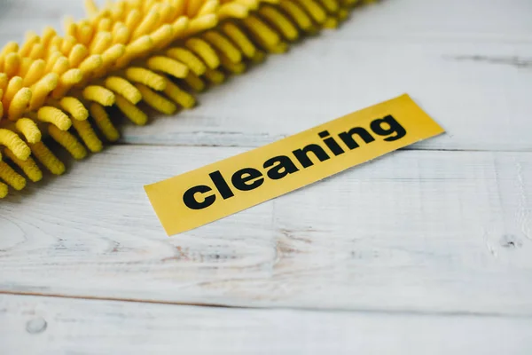 Yellow mop head on white background — Stock Photo, Image