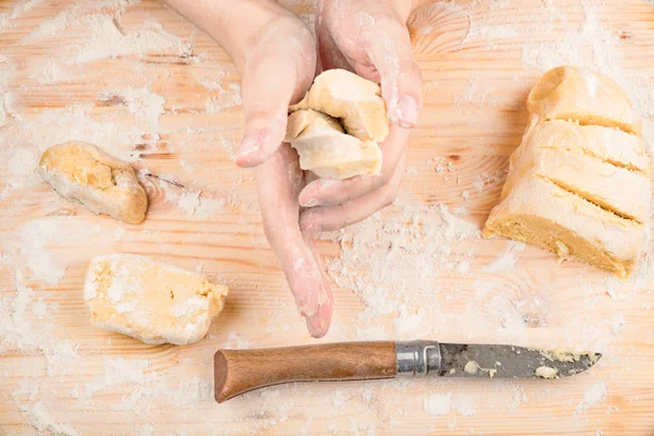Cooking dough on a wooden table — Stock Photo, Image