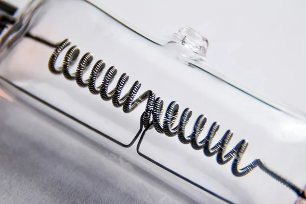 Spiral halogen bulb close-up on a white background.