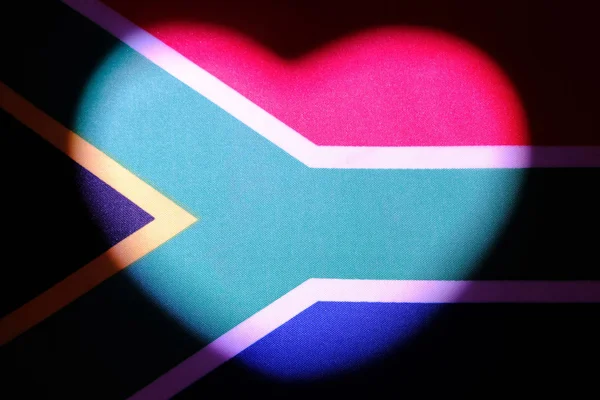 Jihoafrická vlajka, na které je světlá skvrna v podobě srdce. Symbol vztahu a pocitů novomanželů. Koncept lásky, vlastenectví a nezávislosti. Valentýn. Stock Snímky