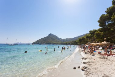 Platja de Formentor, Mallorca - AUGUST 2016 - Tourists swimming 