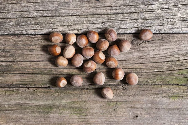 Hazelnuts isolated on wooden — Stock Photo, Image