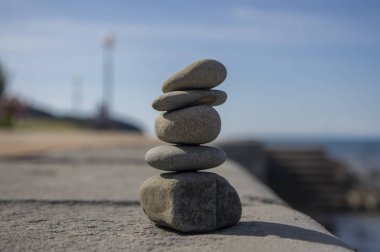 Five stones cairn tower, rock zen sculpture, brown beige pebbles clipart