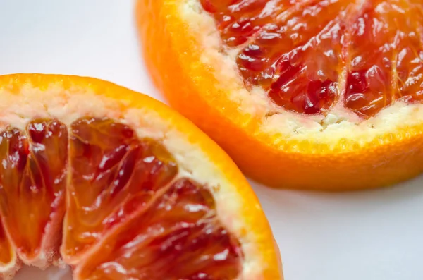 Sliced orange Citrus sinensis  'Blood orange' on white ground