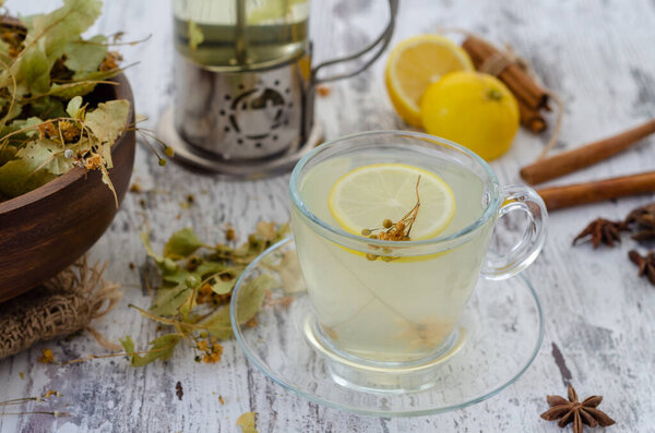 Linden and linden tea. Herbal tea made from linden. Detox herbal tea on wooden table.